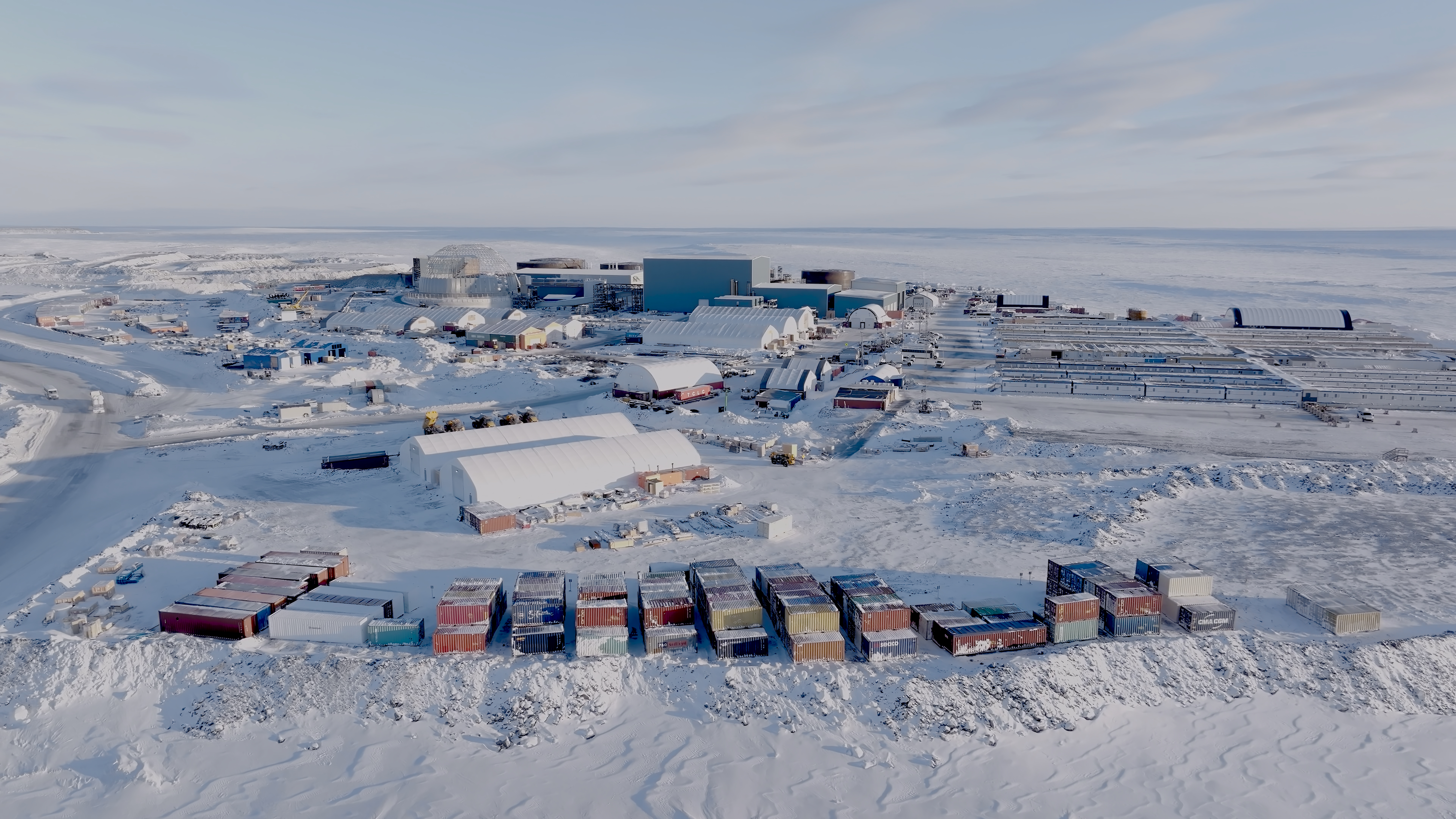 Aerial view of the Goose Project site with ongoing construction, containers, and equipment in the Nunavut region.
